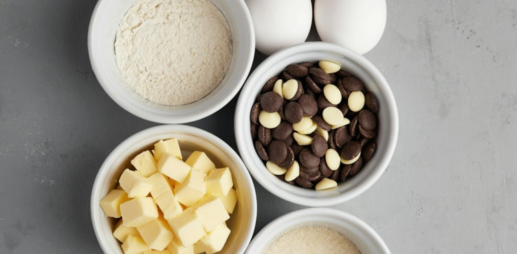 four bowls filled with different types of food